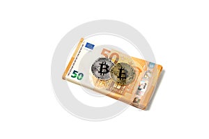 Golden and silver bitcoin over Euro money. Bitcoin cryptocurrency. Crypto currency concept. Bitcoin with euro bills. Bitcoins stac