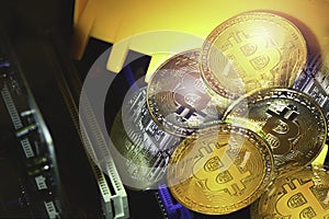 Golden and Silver Bitcoins on Electronics