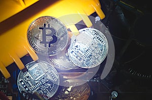 Golden and Silver Bitcoins on Electronics