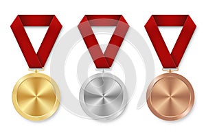 Golden silver and bronze award sport medal with red ribbons