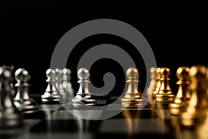 Golden and silver Chess pawn pieces Invite face to face and There are chess pieces in the background. Concept of competing,