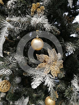 Golden silver Christmas tree close up and Christmas tree decoration ball