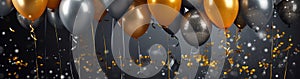 Golden and silver gray metallic balloons and confetti on glistering dark background. Birthday, holiday or party background. Empty