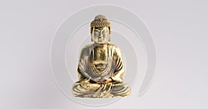 Golden sitting buddha. meditation concept image