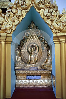 Golden Sitting Buddha in a Pagoda photo