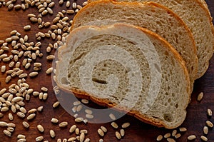 Golden slices of bread and wheat grains