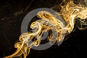 Smoke gold on a black background photo