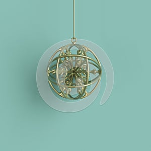 Golden snowflake in golden mercury glass Christmas ornament on green background