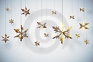 Golden snowflakes on white background