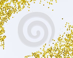 Golden sparkle glittering frame. Golden glitter sand texture frame on white, abstract background with copy space.