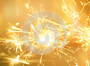 Golden sparkler fire for party celebration background.