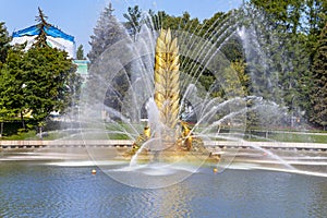 Golden Spike fountain on Kamensky pond in VDNH park. Moscow, Russia