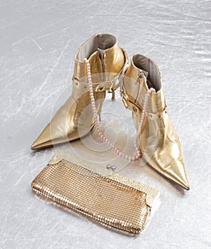 Golden spike heels and purse