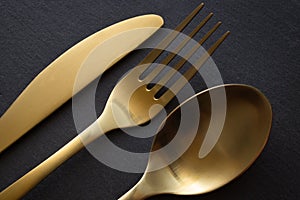 Golden spoon, knife and fork