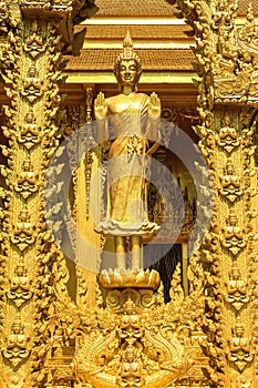 The golden standing Budda statue