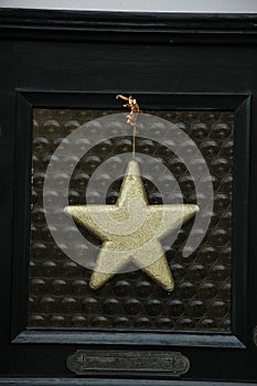 Golden star on glass door