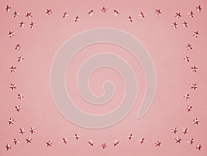 Golden Stars Glitter on Pink Copy Space. Pastel Holiday Style. New Year, Christmas or Celebrate Copyspace Background