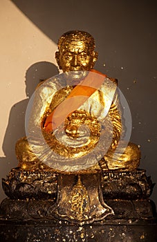 Golden statue of Ban Huai Mongkhon