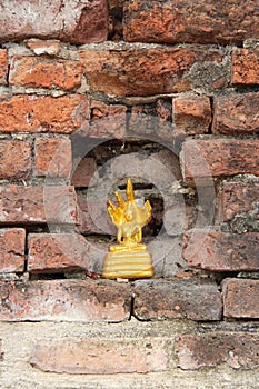 golden statue of buddha in a buddhist temple (wat phra ram) in ayutthaya (thailand)