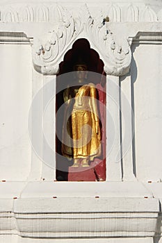 golden statue of buddha in a buddhist temple (wat phra sing) in chiang mai (thailand)