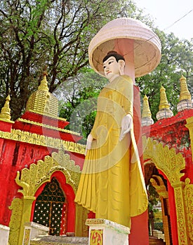 Golden statue buddha at Kyaw Aung San Dar monastery