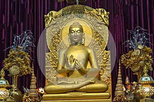 Golden statue Buddha in sitting posture at Sarnath Varanasi India