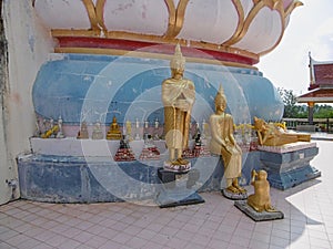 a golden statue in a buddha temple
