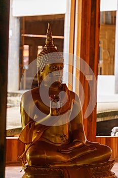 Golden statue of Buddha at the Thai Buddhist temple