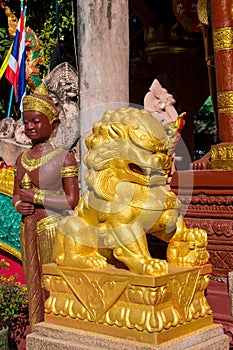 Golden statue in the buddhist temple wat in Thailand