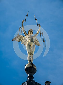 Golden statue on building in Antwerp photo