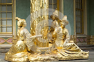 Golden statue in front the Chinese house