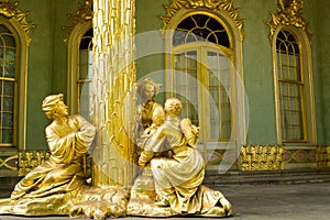 Golden statue in front the Chinese house