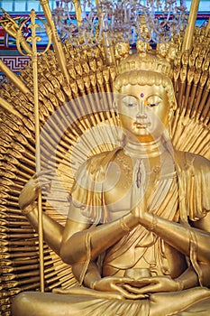 Golden statue of Guan Yin with 1000 hands. Guanyin or Guan Yin i