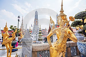 Golden statue of Kinnari at Grand Palace, Thailand