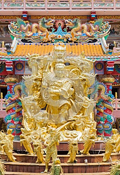 Golden statue of Naja god in Najasataisue Chinese Shrine located