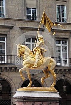 Golden statue of Saint Joan of Arc in Paris photo