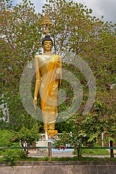 Golden statue of the Standing Buddha in Hat Yai photo