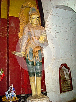 a golden statue in a temple in vietnam