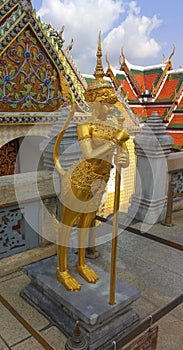 Golden statue in the Wat Phra Kaew, Temple of the Emerald Buddha in Thailand