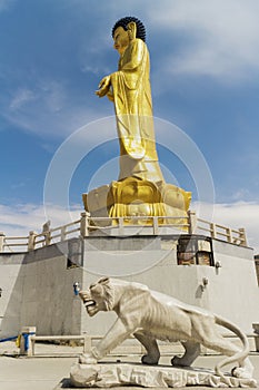Golden statue of young Buddha near the hill Zaisan in Ð£Ð»Ð°Ð°Ð½Ð±Ð°Ð°Ñ‚Ð°Ñ€