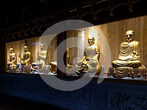 Golden statues of arhats at Nanputuo Temple in Xiamen city, China