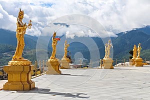 Golden statues of Buddhist Goddesses at top hill in Kuensel Phodrang Nature Park, Thimphu, Bhutan