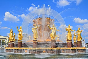 Golden statues of the Friendship of Peoples fountain in VDNKh park