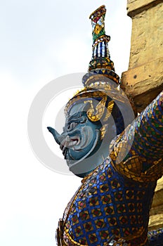 Golden statues Worrier Mosaik colorfull Bangkok temple Thailand buddhism