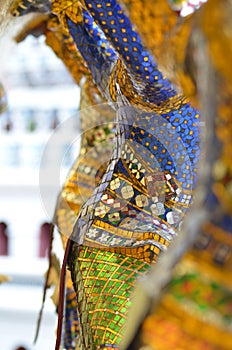 Golden statues Worrier Mosaik colorfull Bangkok temple Thailand buddhism