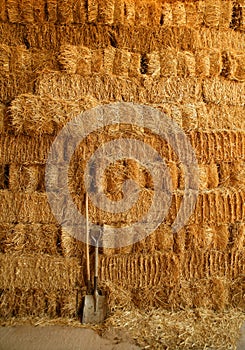 Golden straw bales wall and tools