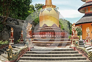 Golden stupa at Brahmavihara Arama. Vihara Buddha Banjar, Buddhist temple monastery in Banjar, Buleleng, Bali, Indonesia