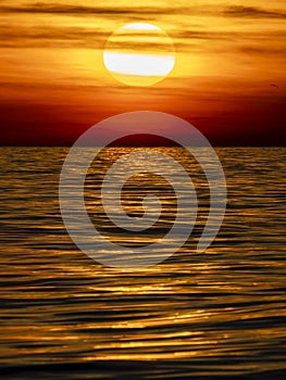 golden sun rays reflection on the sea at sunset