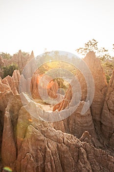 Golden sun shines down around the Sao Din Na Noi site displays picturesque scenery of eroded sandstone pillars. Ancient scenic