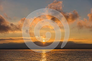 Golden Sunrise behind Alps Mountains and over Lake Leman